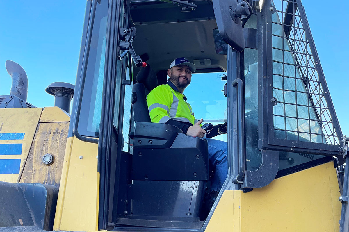 Employee posing in bulldozer